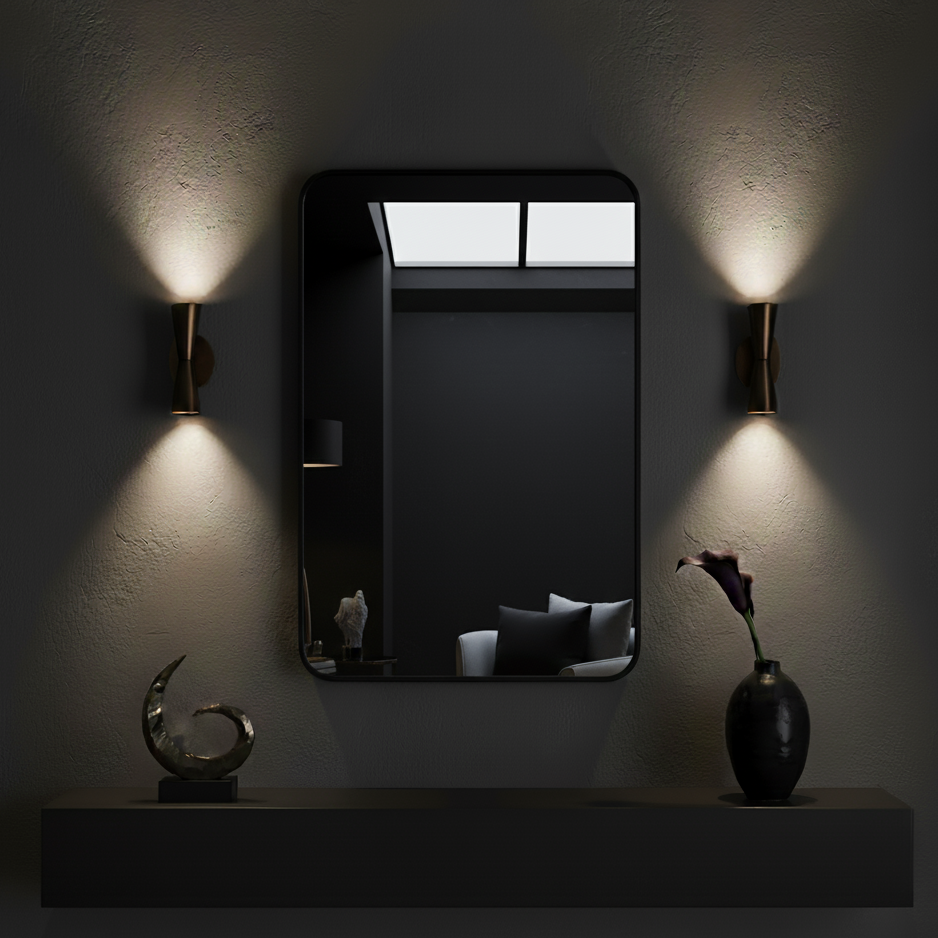 Modern wall mirror with sconces on a dark wall. 