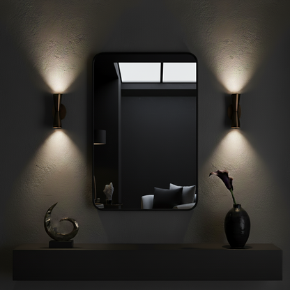 Modern wall mirror with sconces on a dark wall. 